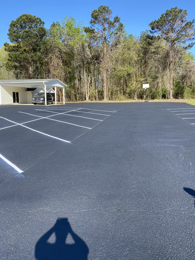Finished sealcoated parking lot with crisp white markings